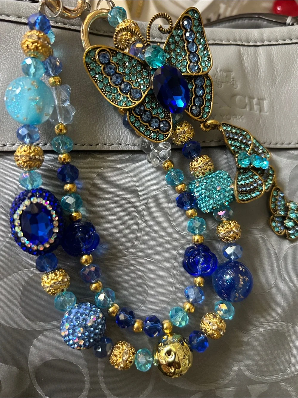 Keychain Blue, Aqua and Gold Beaded Statement Necklace with Butterfly Accent